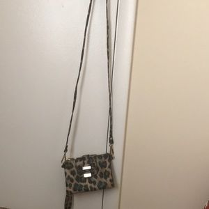 A cheetah print clutch/Crossbody bag